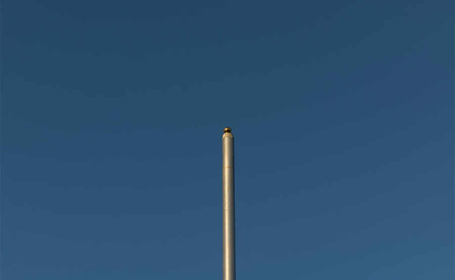 Een vlaggenmast in de tuin plaatsen: waar let je op?